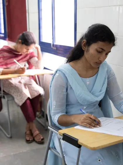 Students taking their written language proficiency exams. We conduct formal assessments to certify their skills in reading, writing, listening, and speaking.
