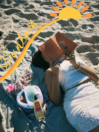 Sunbathing with a good book. I added a sun doodle to emphasize the sunny day and relaxed vibe.