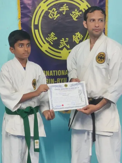 This young student has earned his 4th Kyu (green belt). His journey is a great example of the character development that comes from traditional karate training.