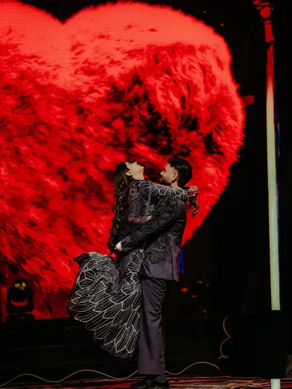 A Sangeet night is a performance of love. Here, I framed the couple against a giant, glowing heart on the LED screen, lifting them into a moment that is both epic and deeply romantic, capturing the peak of their celebration.