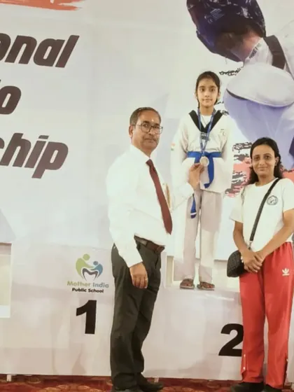 Naysha on the podium after winning a silver medal at the CBSE National Taekwondo Championship in Uttarakhand.