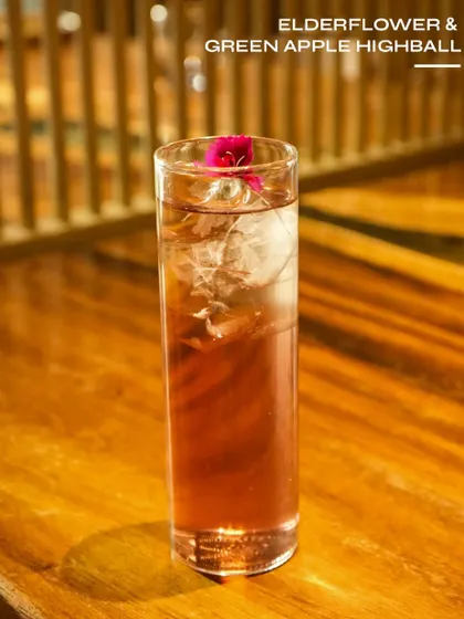 The Elderflower & Green Apple Highball, a crisp and floral drink.
