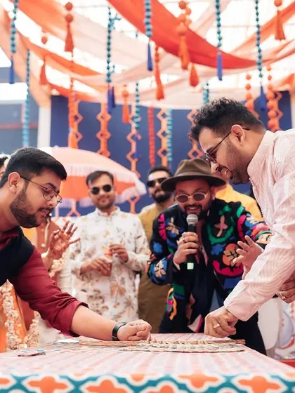 A candid shot of me organizing a game at a Haldi carnival in Jaipur. I'm right there with the guests, ensuring the rules are clear and the fun is maximized.