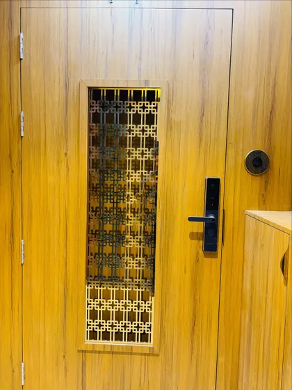 A detailed close-up of the intricate jaali work on the safety door.
