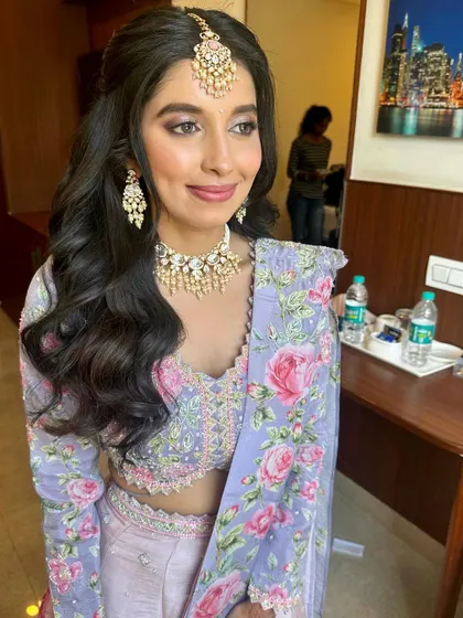 A sweet client ready for her engagement in a lovely floral lehenga.