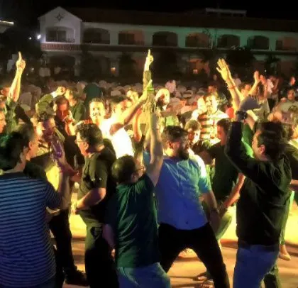 The party in full swing at an outdoor corporate event. The open space and great music made for a perfect evening of celebration.