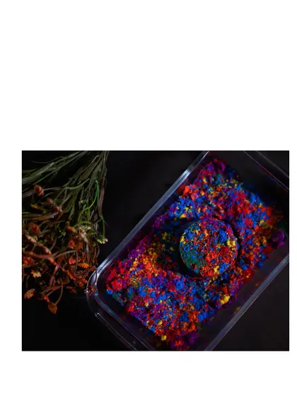 A creative shot using Holi colors. This image, showing the raw and edited versions, demonstrates my skill in product styling and post-production to create a vibrant final image.
