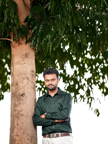 A casual solo portrait of the groom-to-be during an outdoor shoot in Palladam.