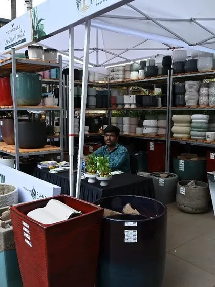 A closer look at the beautiful and varied collection of planters available at a vendor stall. We curate a market that caters to every taste and gardening need.