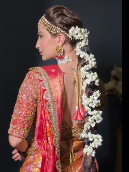 A side view of the floral braid, showing how it is constructed to be both beautiful and secure for a long wedding ceremony.