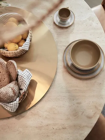A top-down view of the Siena dining table, highlighting the unique and beautiful patterns of the premium travertine stone. Every table is a unique piece of nature's art, bringing a sense of serenity to your dining space.