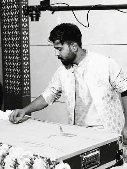 A black and white shot of me at work during the Rotary Club event in Muzaffarnagar. This captures the focus and precision required during a live performance, where every movement of the hand matters.
