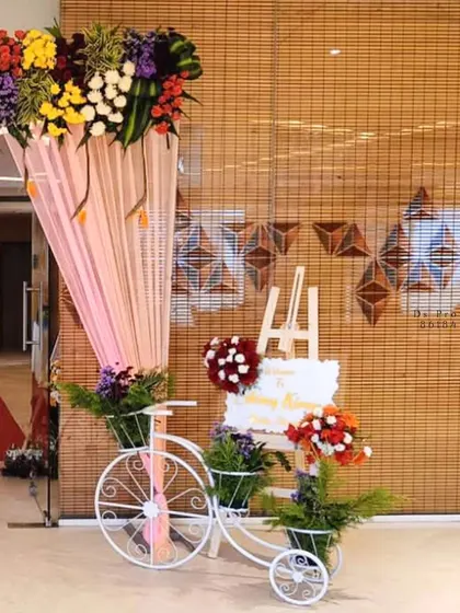 A duplicate image of the beautiful entrance decor with a floral bicycle.