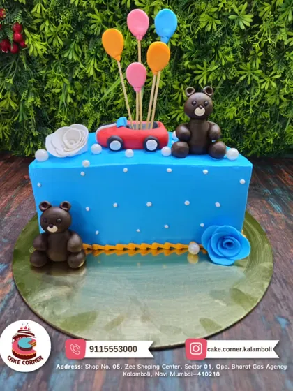 Another adorable car and teddy bear themed cake. The bright blue cake with a red car, balloons, and cute bears is perfect for a young child's party.
