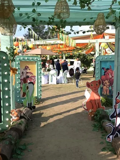 The entrance walkway to the Lion King party, lined with illuminated frames showcasing scenes and characters from the movie.