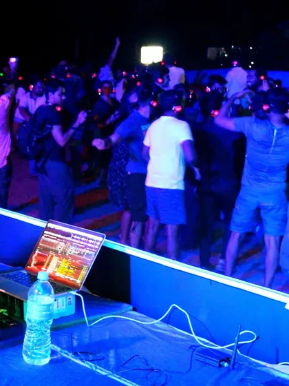 The unique experience of a silent disco, where everyone dances to their own beat. It's a fun and interactive party format.