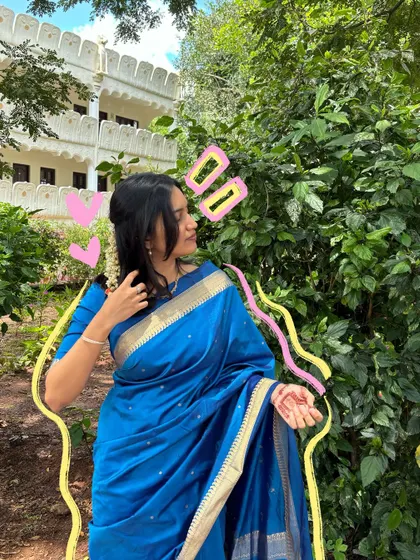 A beautiful blue saree deserves some love. The pink and yellow doodles add a fun, contrasting pop of color.