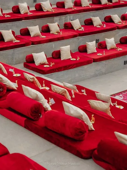 The deep red of the seating provides a beautiful contrast against the grey stone of the venue.