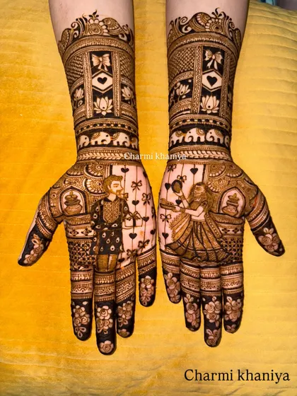 A close-up of the couple portraits in this Teej mehendi.