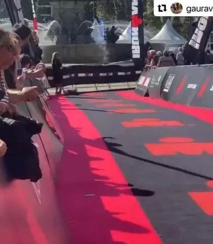 Crossing the finish line at the IRONMAN event. An unforgettable moment for any athlete and their coach.