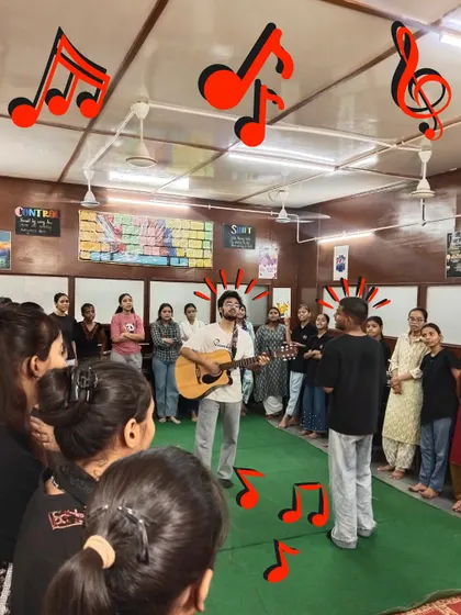 A student stands up to sing with his instructor, surrounded by his peers. This moment of individual courage is a huge step in a child's journey of building self-confidence.