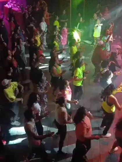 The crowd at the 'Let Loose' event was incredible. This bird's-eye view shows the scale of the party, with everyone on the floor moving to the beat under the vibrant lights.