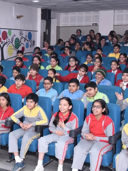 The captivated faces of students at The Chintels School. Their expressions show how a good story can transport you, making learning about science and character traits feel like pure entertainment.