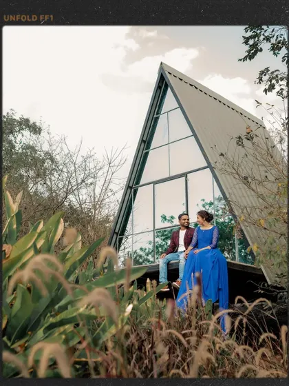 A creative shot of the couple at the A-frame cabin, framed with a vintage film border.