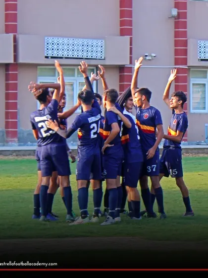 "Un, Dos, Tres, ESTRELLA!" The team comes together in celebration, a ritual that builds unity and team spirit after a hard-fought game.