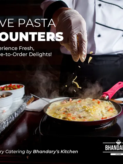I bring the restaurant experience to you with interactive live counters. Here, one of my chefs prepares fresh pasta to order, providing both entertainment and a made-for-you meal that elevates any corporate lunch or event.