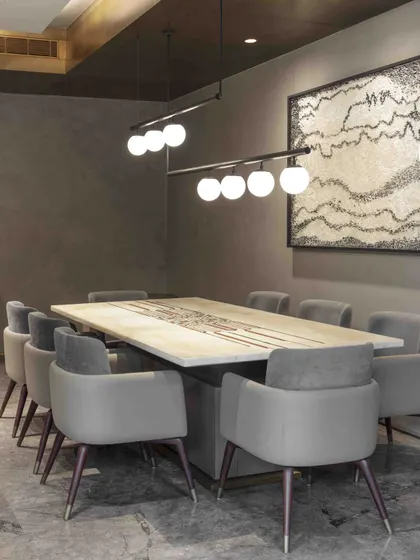 The ground floor family lounge includes an informal dining area, perfect for everyday meals. The space is personalized with a gallery wall of family photos, infusing the room with warmth and history.