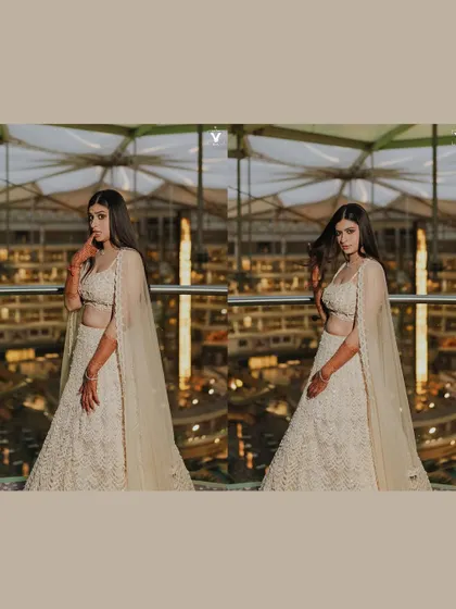 A collage of the bride in her modern white sangeet lehenga. The shots capture her confident poses against a backdrop of city lights, showcasing her chic and stylish look.