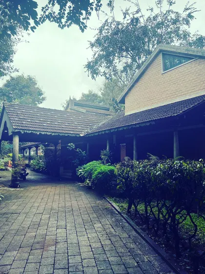The pathway to our meditation hall, surrounded by the quiet beauty of our retreat grounds. Every corner of this space is filled with a palpable sense of peace.