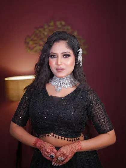 A close-up of the black sequin lehenga's blouse and the stunning diamond choker.