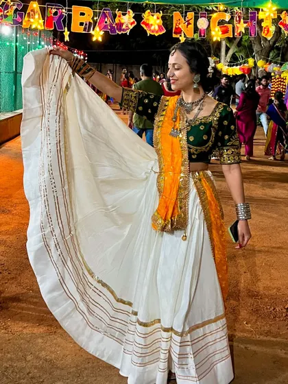 Showing off the beautiful flare of a traditional Garba outfit. The right costume is a key part of the performance, and I can help guide your choices.