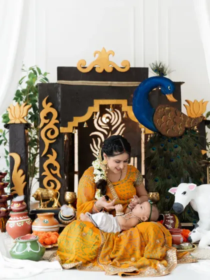 The eternal love of Yashoda and her little Kanha. This photo captures a mother's tender love for her baby in our beautiful Janmashtami-themed setup.