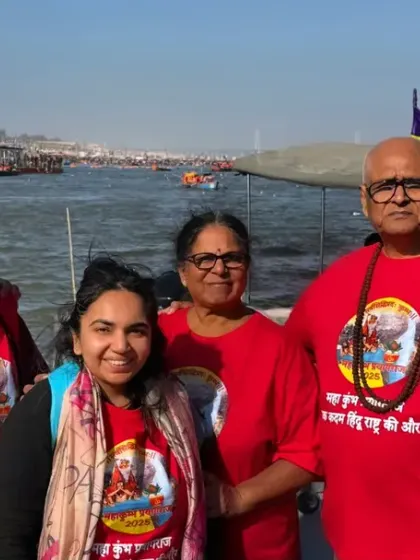 Rooted in culture, styled by WYO. This family shows their devotion during Kumbh Mela with matching red t-shirts featuring a spiritual print.