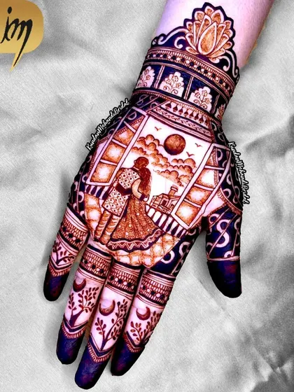 A single hand from a Karwa Chauth set, showing a couple on a terrace with the sun setting. This is storytelling through henna.