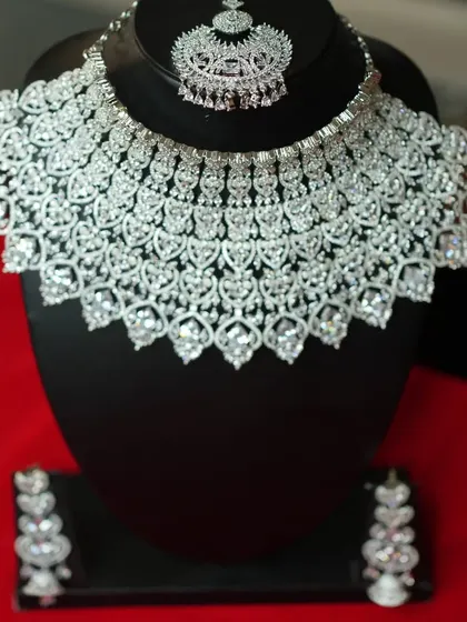 A close-up of a heavy American diamond bridal choker. The craftsmanship is exquisite.