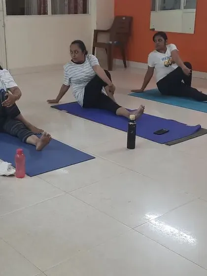 A duplicate of image 41, showing the seated spinal twist practice.