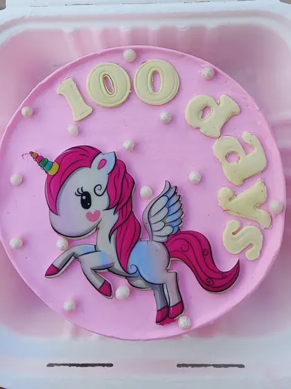 A sweet unicorn bento cake to celebrate 100 days. This mini cake features a winged unicorn, perfect for a magical little milestone.