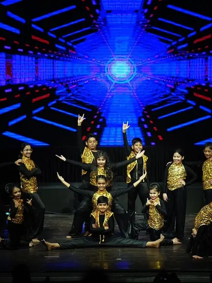 A full-stage view of the kids' hip hop pyramid, highlighting their impressive skills and stage presence.