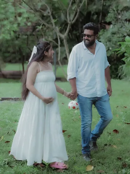 Hand in hand, they walk towards their future as a family. This candid photo captures the joy and movement of their journey together.