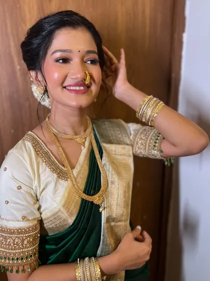 A happy and radiant bride-to-be. Her smile says it all. The makeup is kept fresh and minimal to enhance her natural beauty for her engagement day.