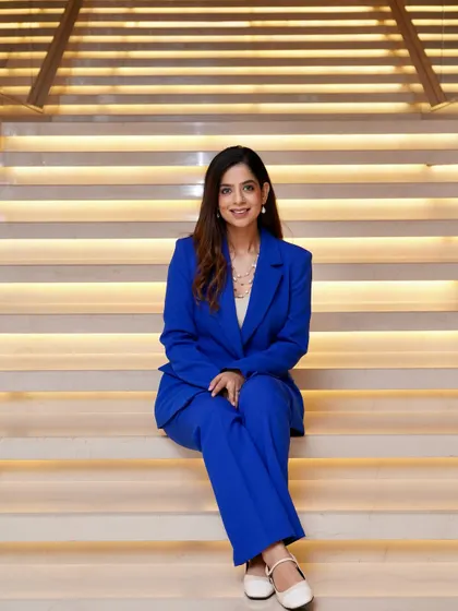 Another seated pose, highlighting the full suit. A well-fitted suit is my go-to for making a strong first impression at business events.