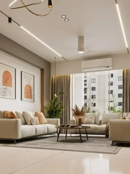 We use strategic lighting to enhance our living room designs. This space features track lighting and linear LEDs to create a modern and gallery-like feel, highlighting the minimalist decor.