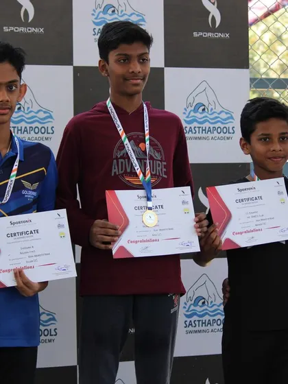 Three champions stand tall on the podium, representing the culmination of their hard work.