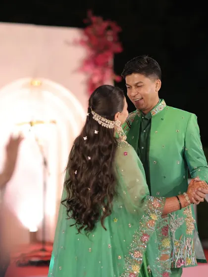 Another beautiful moment between the couple, with the bride's romantic butterfly hairstyle on full display. This style is perfect for creating memorable wedding photos.