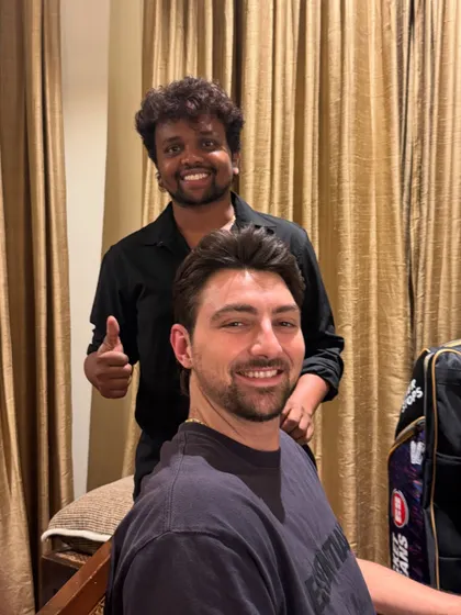 Tim David giving a thumbs up after his haircut. Simple, clean, and client-approved.