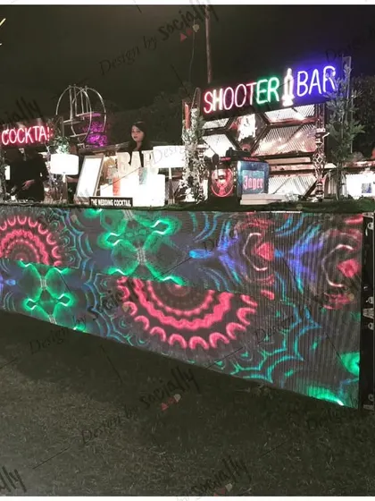 I provide complete, professional bar setups that become a centerpiece for your event. This large LED bar can be customized with graphics and visuals to match your party's theme.